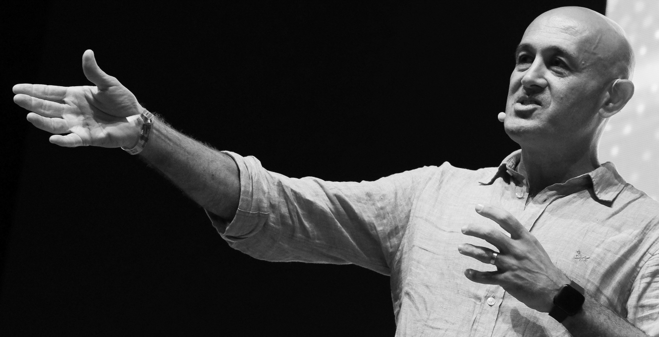 Photograph of PUP Speaks author Jim Al-Khalili gesticulating on stage.