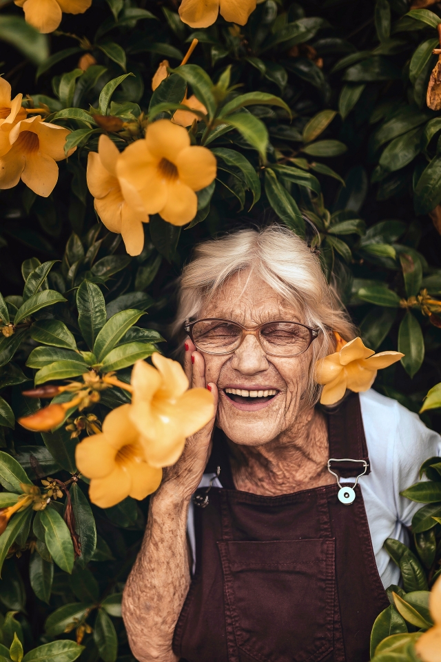 Old woman with flowers