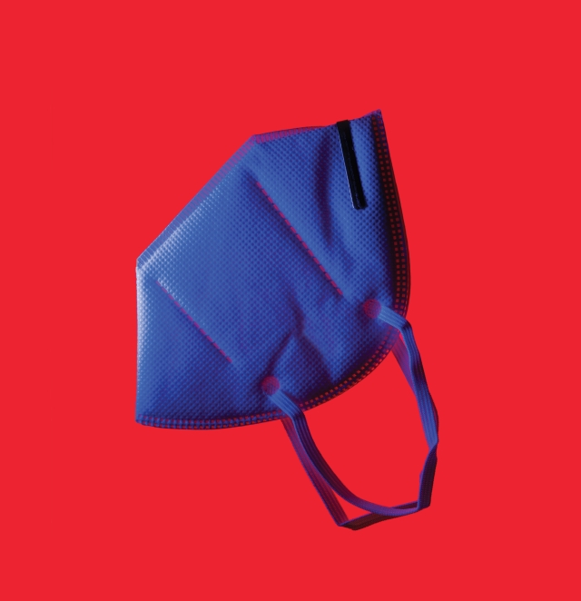 Blue face mask on red background