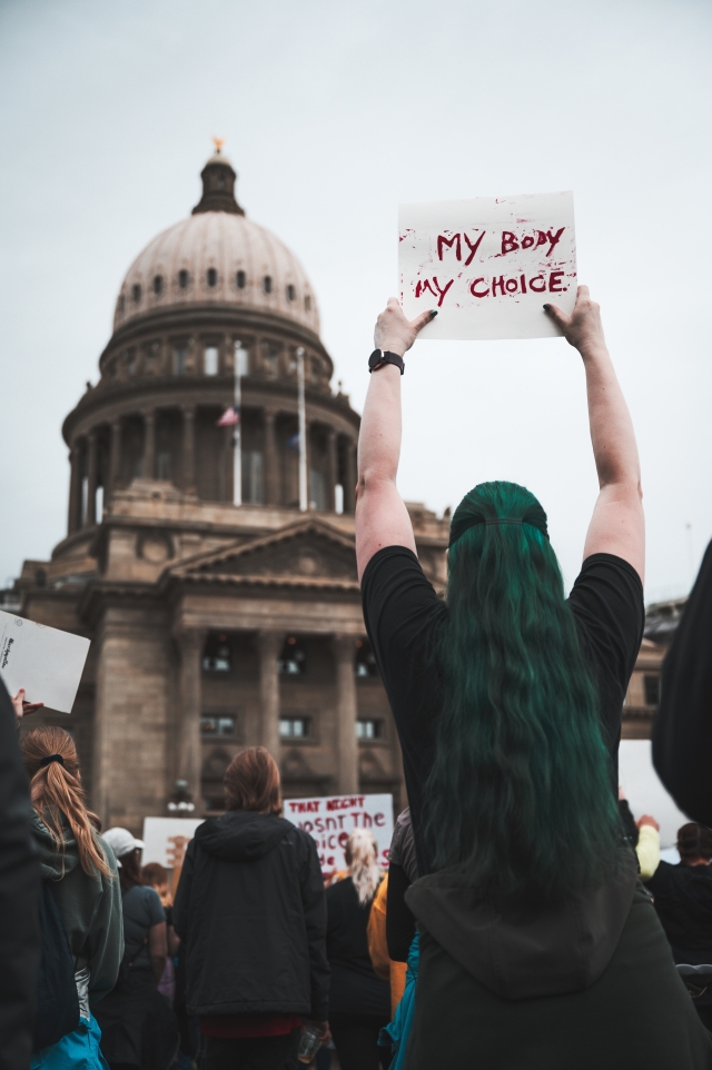 Protester holding a sign outside the capital reading "My Body, My Choice"