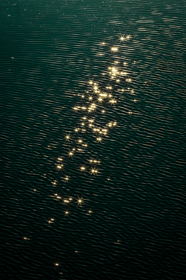 Rippled water with sparkling reflections of sunlight