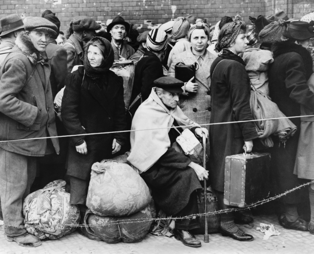 Crowd of refugees with belongings