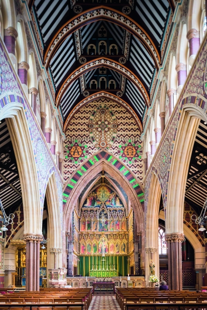 Interior photo of All Saints Church showing the ornate decoration and arched ceiling