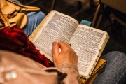 Image of person reading religious text