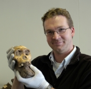 Jeremy DeSilva holding a skull