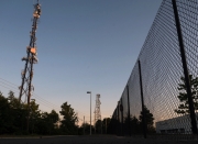 High frequency tower and chainlink fence