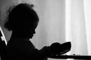 silhouette of child with empty food bowl