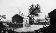 Råshult, Linnaeus’s place of birth. Greyscale image of cabins and trees.