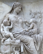 Relief sculpture of female Goddess with twins on the Ara Pacis.